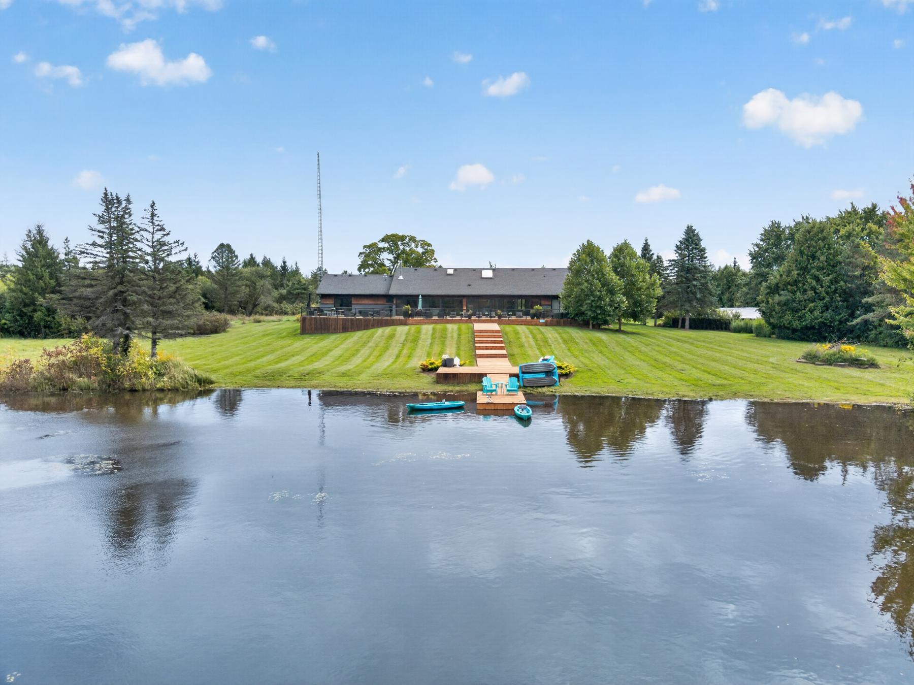 The lake at 985 Valens Road, looking back to the house and dock
